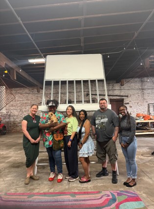 Johanna, Monya, Aaron and Cassandra at Michelle Browder&rsquo;s Mothers of Gynecology exhibit in Montgomery, Alabama. The chair pictured commemorates the Alabama Riverfront Brawl.